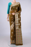 Pure Silk Mehandi Green Banarasi Raw Saree with Zari And Thread Butta on the body and Zari And Thread Border.  displayed on a mannequin