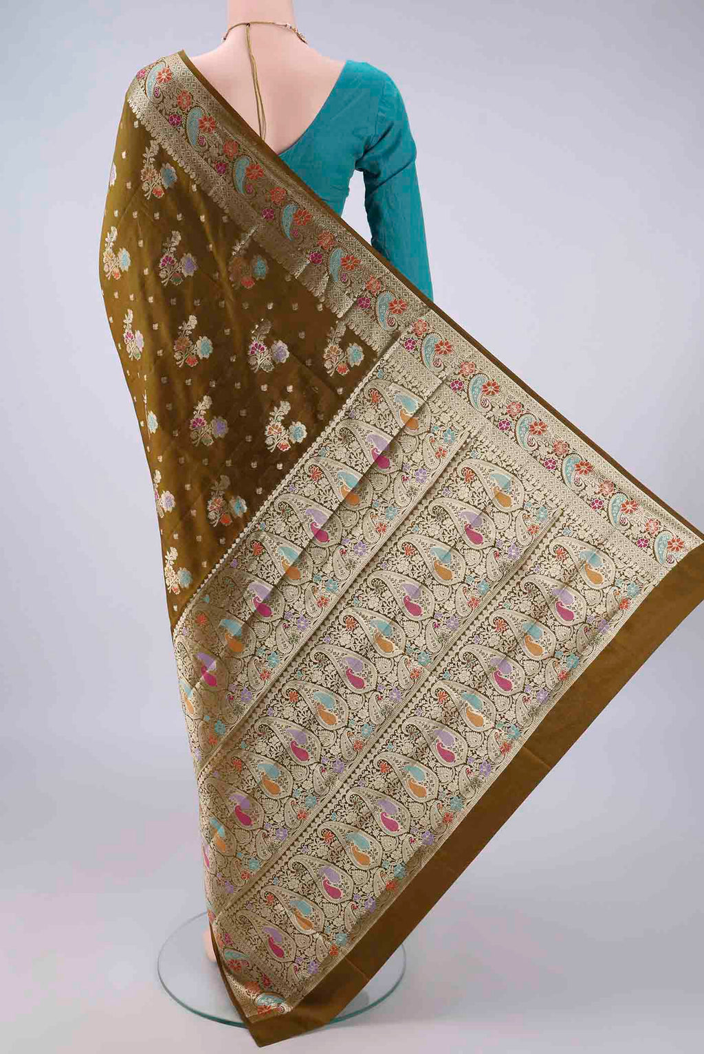 Flat view of Pure Silk Mehandi Green Banarasi Raw Saree with Zari And Thread Butta on the body and Zari And Thread Border. 
