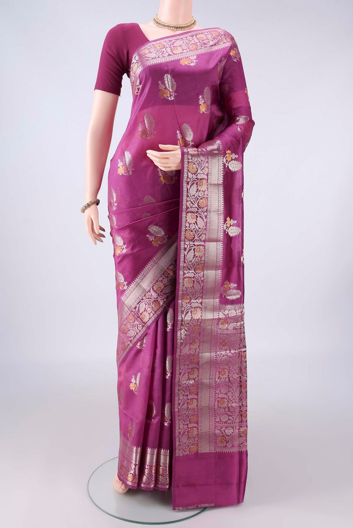 Pure Silk Pink Banarasi Raw Saree with Zari And Thread Butta on the body and Zari Border.  displayed on a mannequin