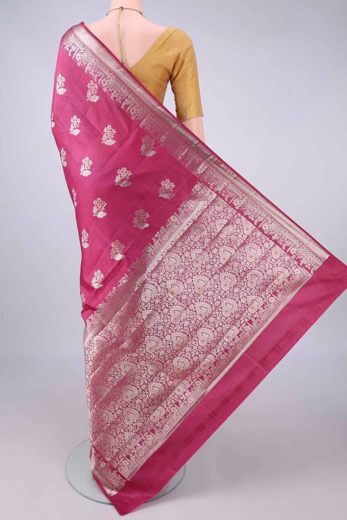 Flat view of Pure Silk Dark Pink Banarasi Raw Saree with Zari Butta on the body and Zari Border. 