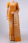 Pure Silk Mustard Banarasi Raw Saree with Zari Butta on the body and Zari Border.  displayed on a mannequin