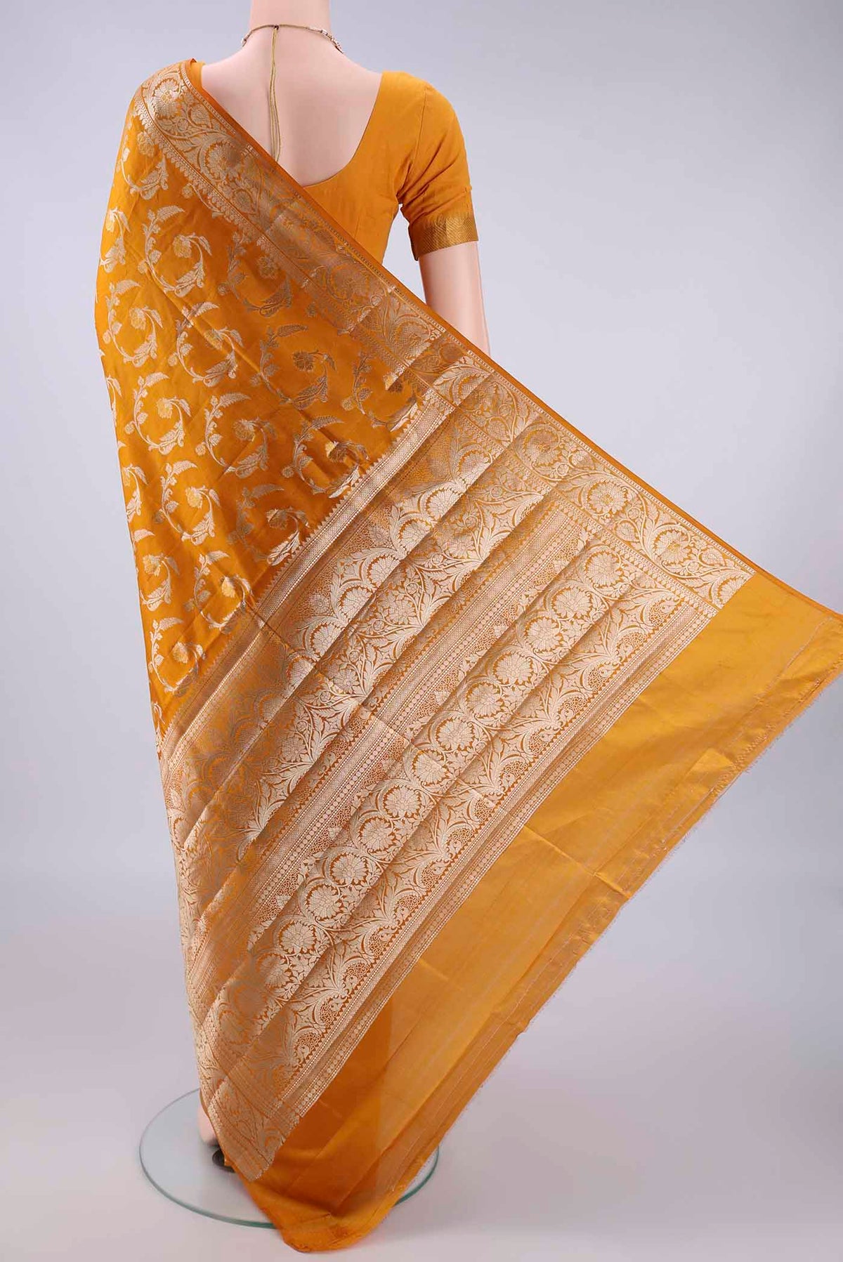 Flat view of Pure Silk Mustard Banarasi Raw Saree with Zari Butta on the body and Zari Border. 