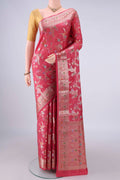 Pure Silk Coral Banarasi Raw Saree with Zari And Thread Butta on the body and Zari And Thread Border.  displayed on a mannequin