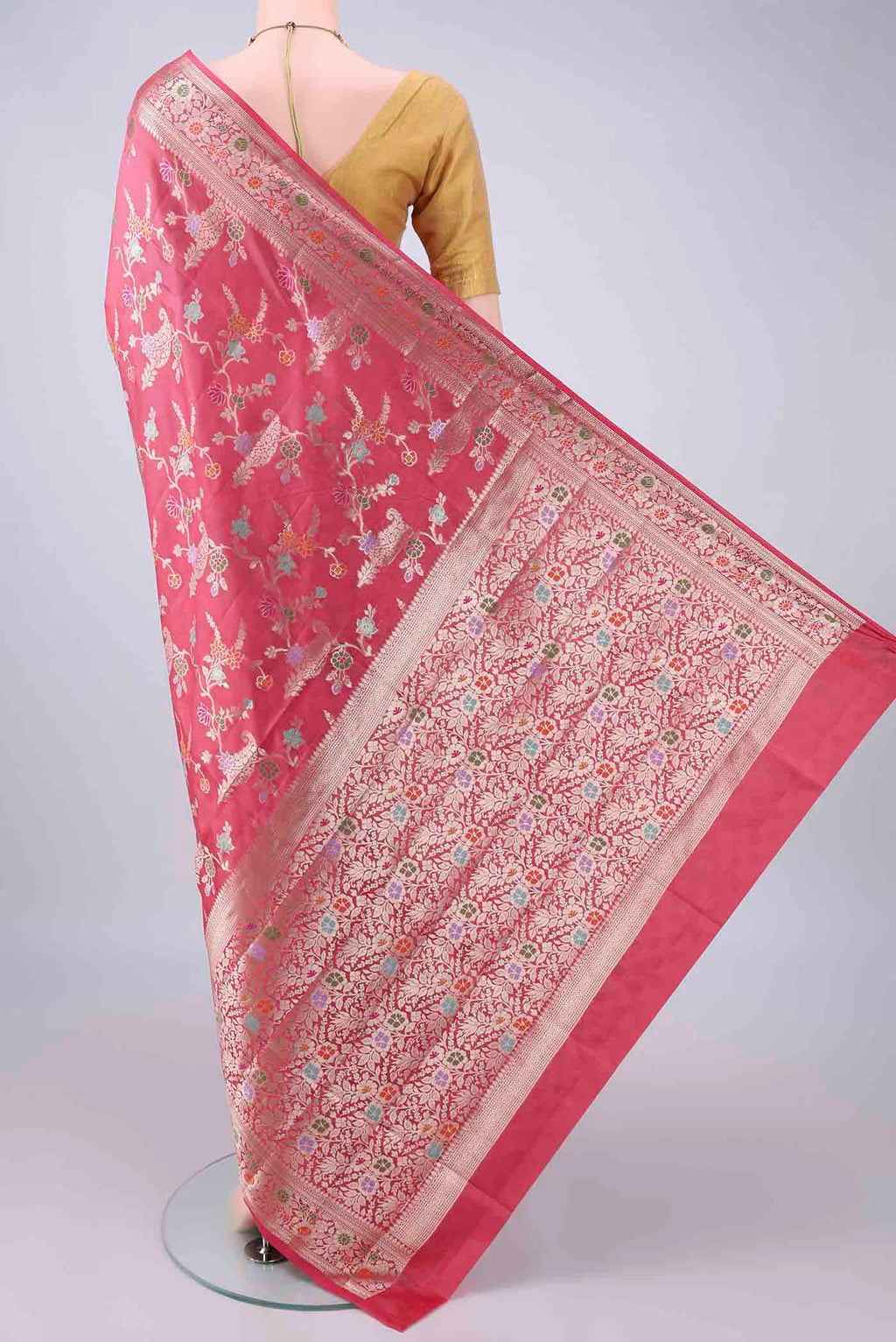 Flat view of Pure Silk Coral Banarasi Raw Saree with Zari And Thread Butta on the body and Zari And Thread Border. 