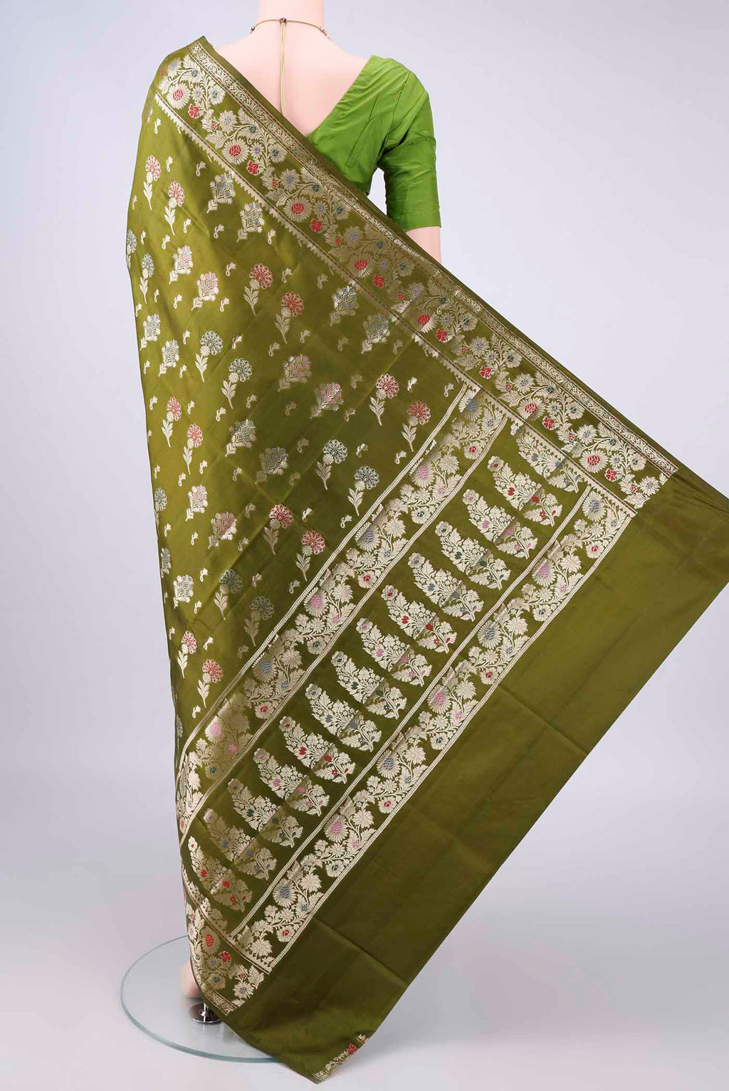 Flat view of Pure Silk Mehandi Green Banarasi Raw Saree with Zari And Thread Butta on the body and Zari Border. 