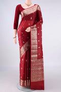 Rust Banarasi Raw Saree with Zari And Thread Butta on the body and Zari And Thread Border.  displayed on a mannequin