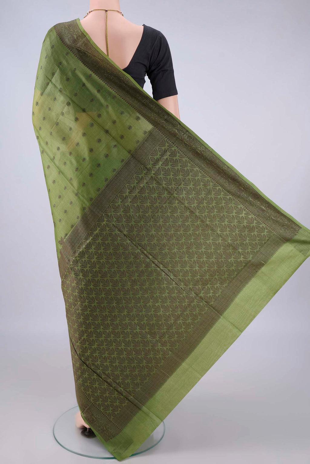 Flat view of Light Green Banarasi Tussar Saree with Thread Butta on the body and Thread Border. 