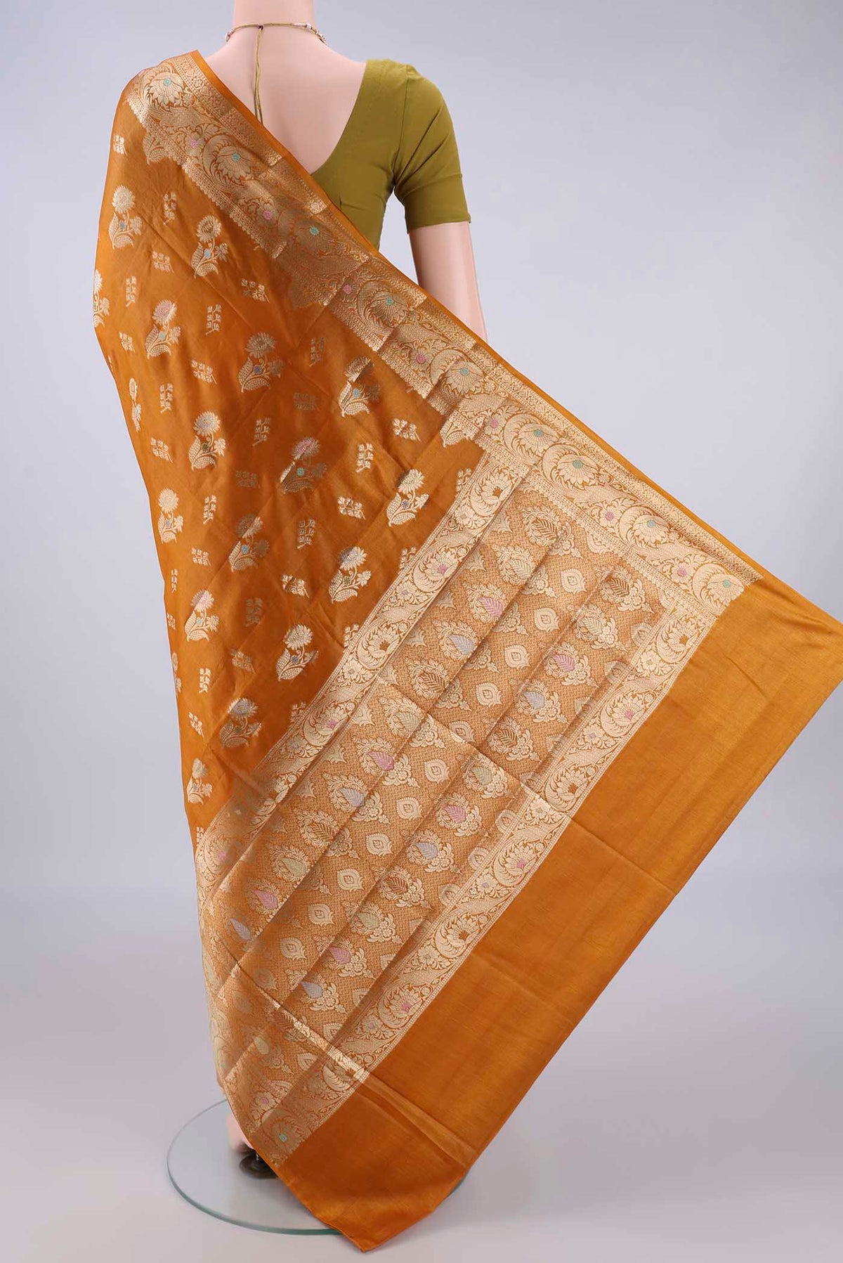 Flat view of Mustard Banarasi Tussar Saree with Zari And Thread Butta on the body and Zari And Thread Border. 