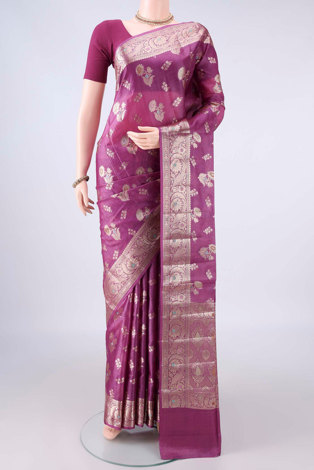 Pink Banarasi Tussar Saree with Zari Butta on the body and Zari And Thread Border.  displayed on a mannequin