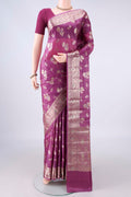 Pink Banarasi Tussar Saree with Zari Butta on the body and Zari And Thread Border.  displayed on a mannequin