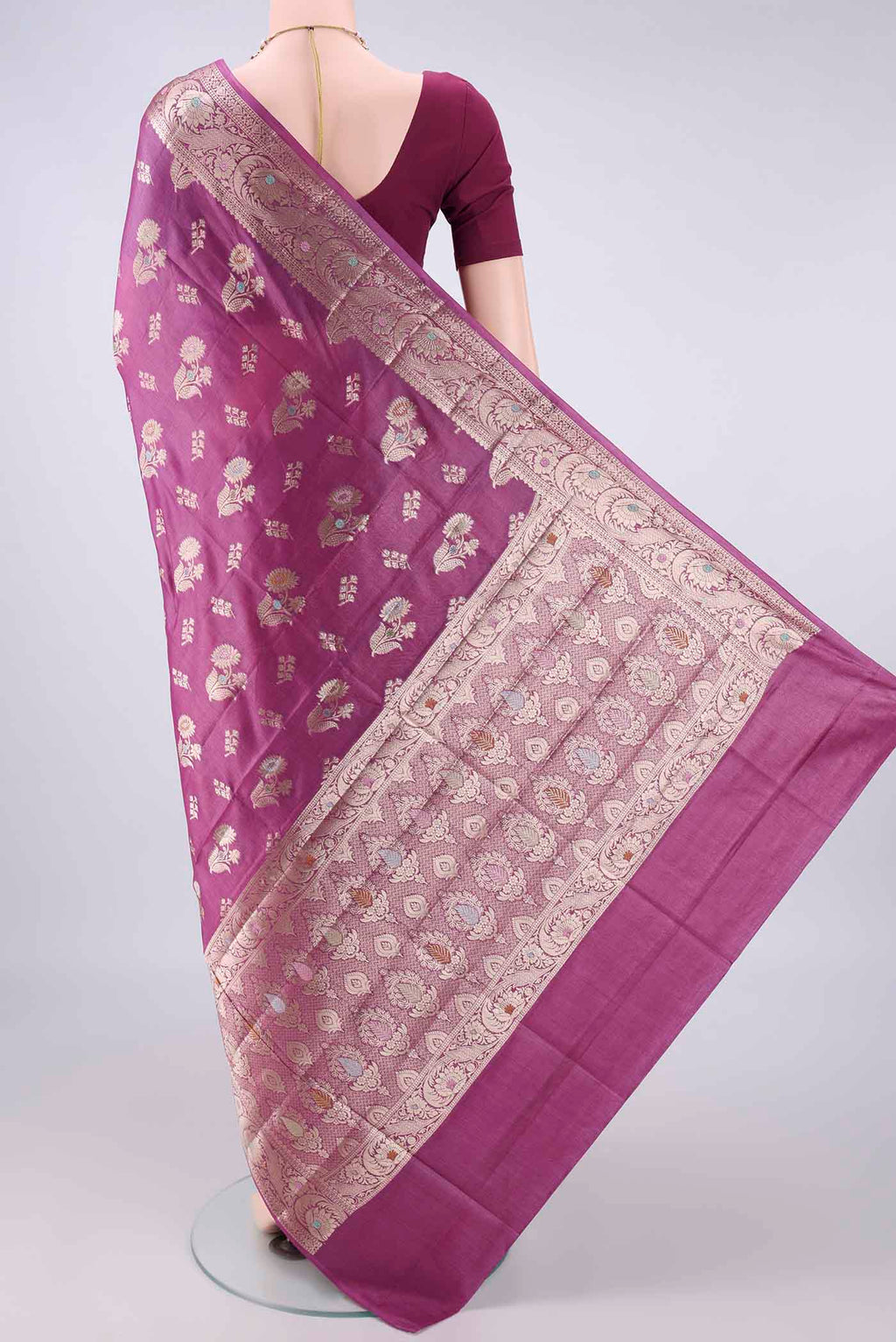 Flat view of Pink Banarasi Tussar Saree with Zari Butta on the body and Zari And Thread Border. 