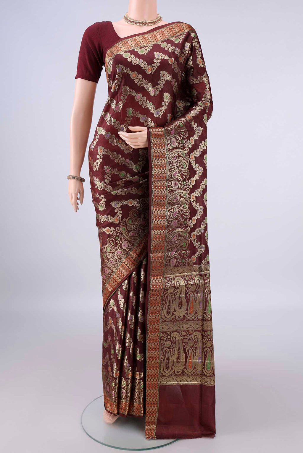 Brown Banarasi Tussar Saree with Zari Brocade on the body and Zari Border.  displayed on a mannequin