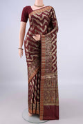 Brown Banarasi Tussar Saree with Zari Brocade on the body and Zari Border.  displayed on a mannequin