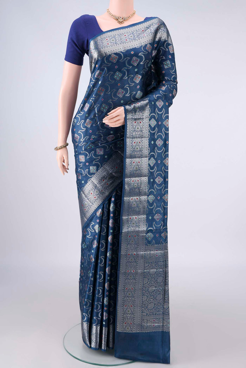 Blue Banarasi Tussar Saree with Zari Brocade on the body and Zari And Thread Border.  displayed on a mannequin