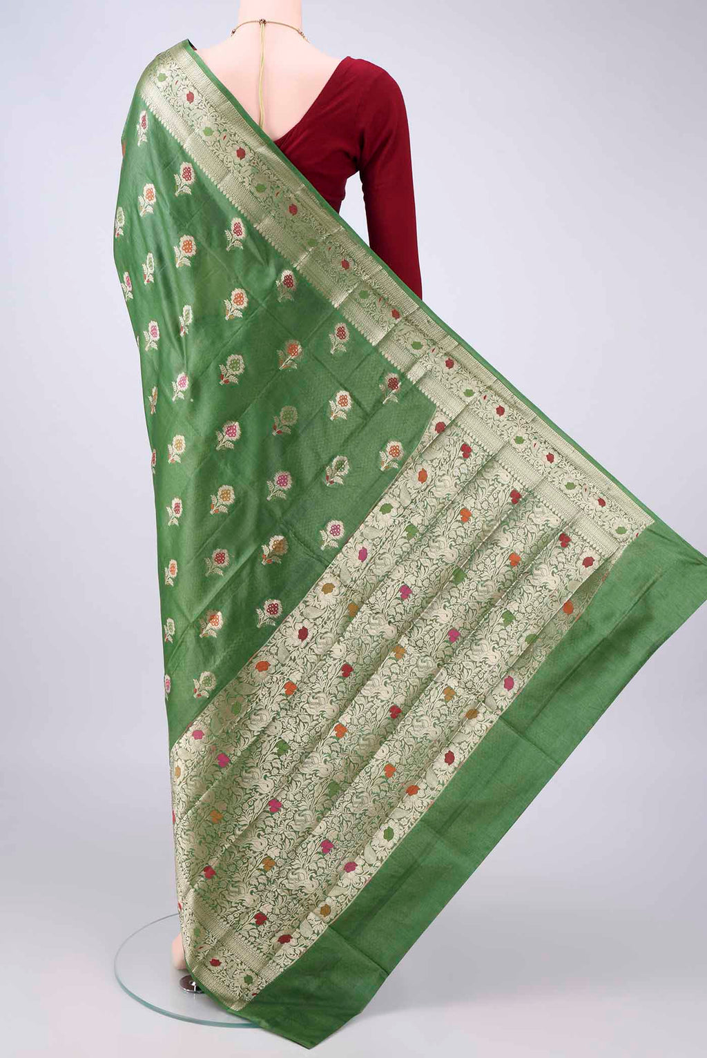 Flat view of Green Banarasi Tussar Saree with Zari And Thread Butta on the body and Zari And Thread Border. 