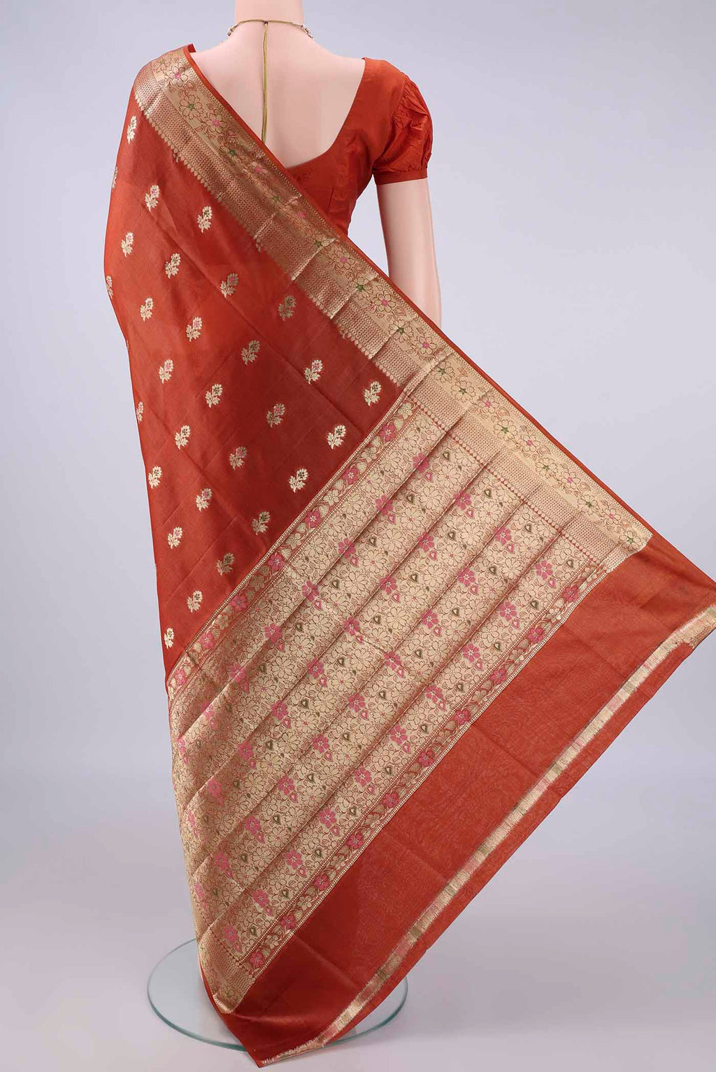Flat view of Rust Banarasi Tussar Saree with Zari And Thread Butta on the body and Zari And Thread Border. 