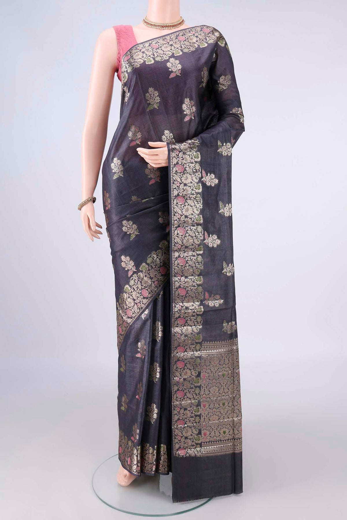 Davys Grey Banarasi Tussar Saree with Zari And Thread Butta on the body and Zari And Thread Border.  displayed on a mannequin