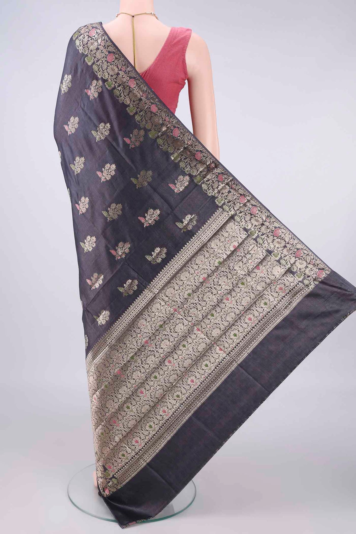 Flat view of Davys Grey Banarasi Tussar Saree with Zari And Thread Butta on the body and Zari And Thread Border. 