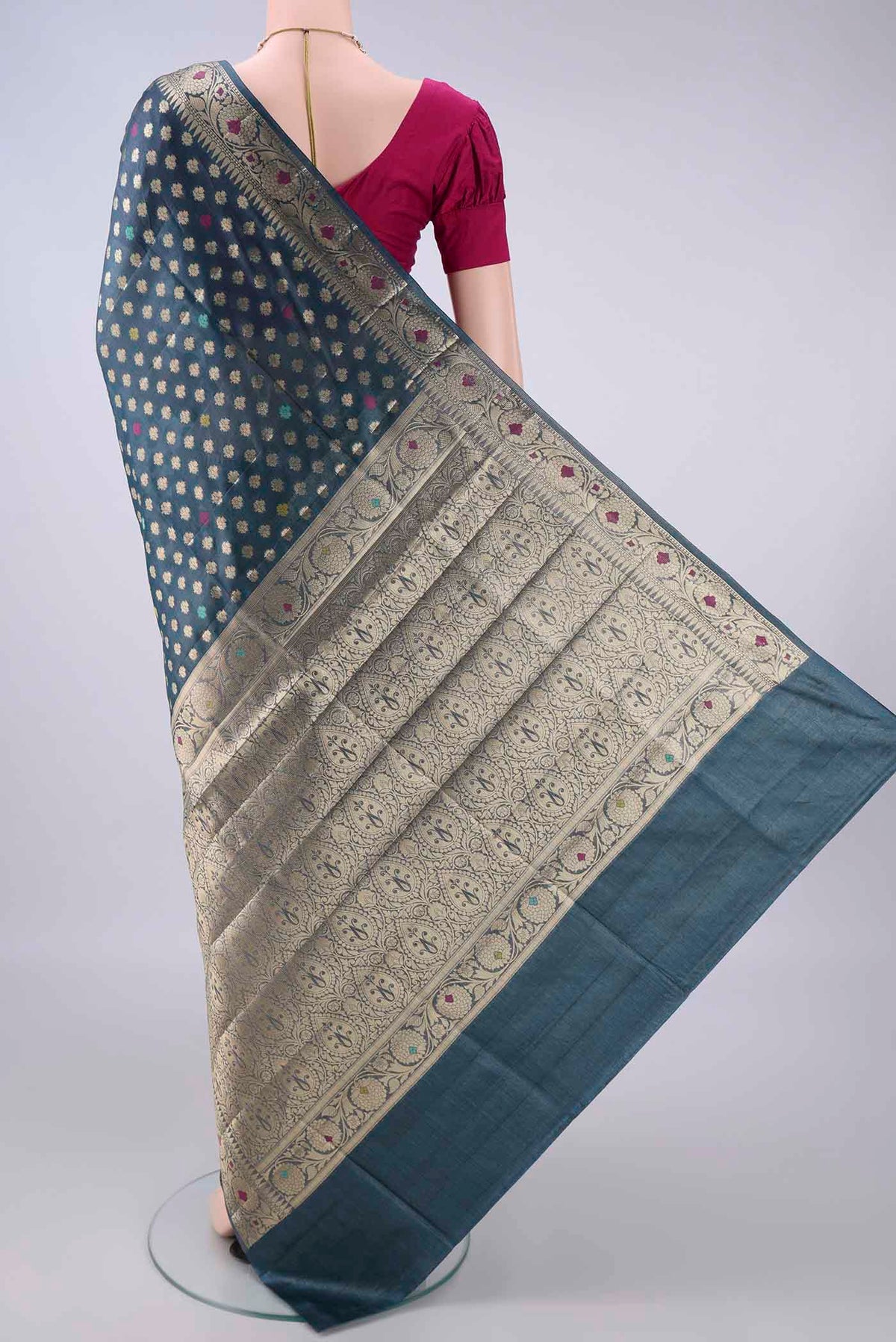 Flat view of Blue Grey Banarasi Tussar Saree with Zari And Thread Butta on the body and Zari And Thread Border. 
