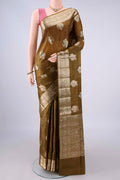 Mehandi Green Banarasi Tussar Saree with Zari And Thread Butta on the body and Zari And Thread Border.  displayed on a mannequin