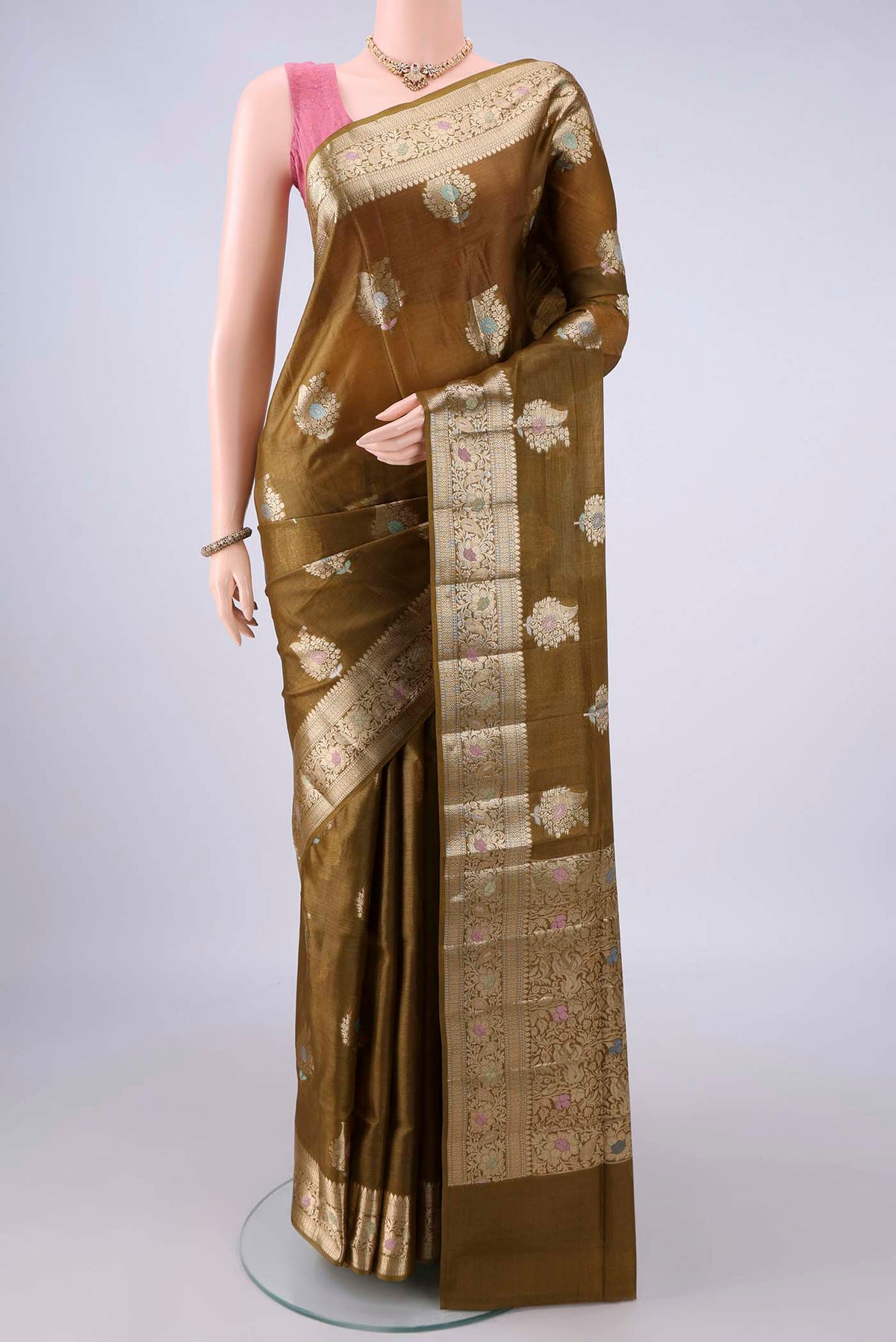 Mehandi Green Banarasi Tussar Saree with Zari And Thread Butta on the body and Zari And Thread Border.  displayed on a mannequin