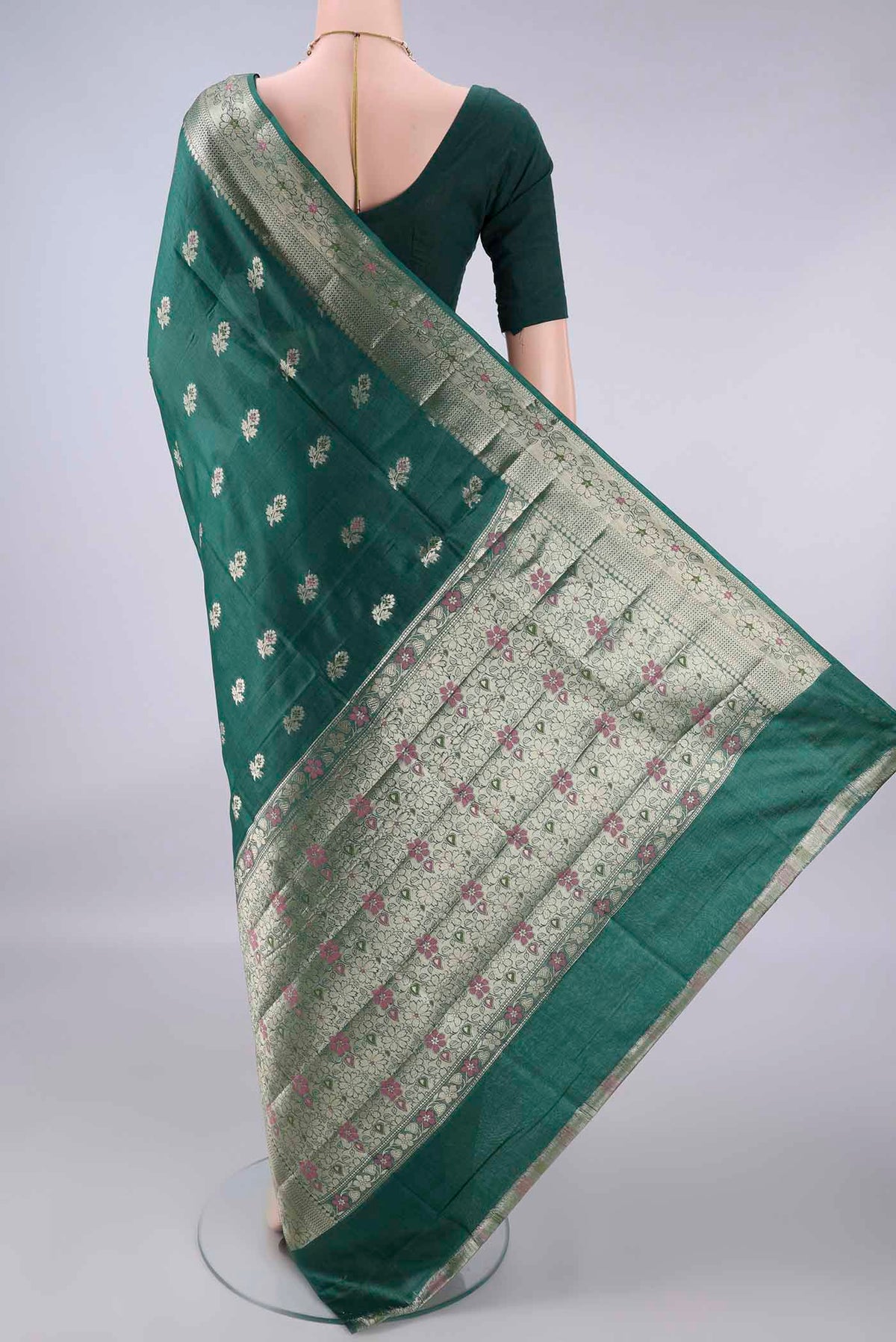 Flat view of Bottle Green Banarasi Tussar Saree with Zari And Thread Butta on the body and Zari And Thread Border. 