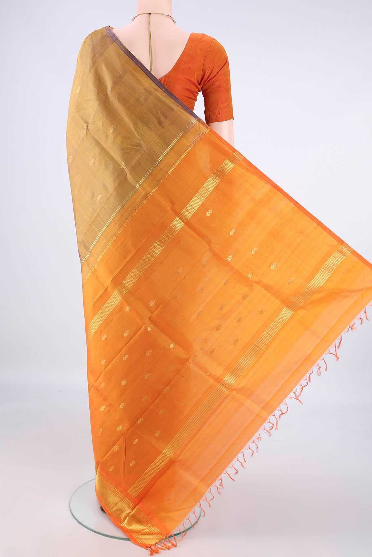 Flat view of Pure Silk Golden Kanjivaram Saree with Zari Butta on the body and Zari Border. 