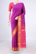 Pure Silk Magenta Kanjivaram Saree with Zari Butta on the body and Zari Border.  displayed on a mannequin