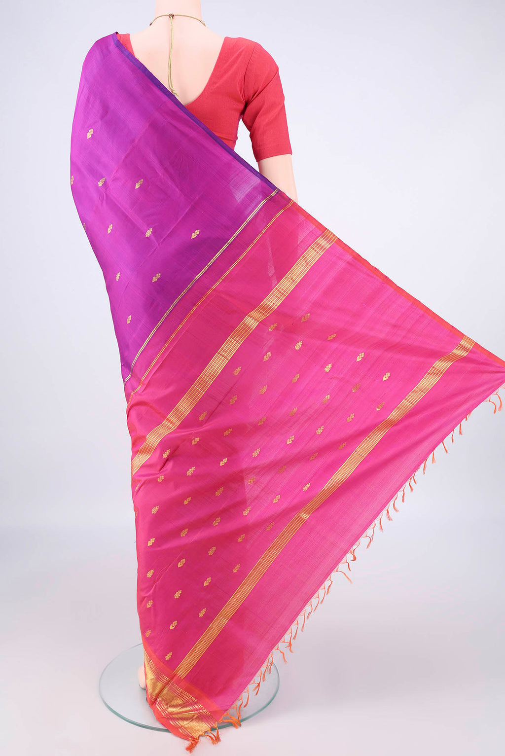 Flat view of Pure Silk Magenta Kanjivaram Saree with Zari Butta on the body and Zari Border. 