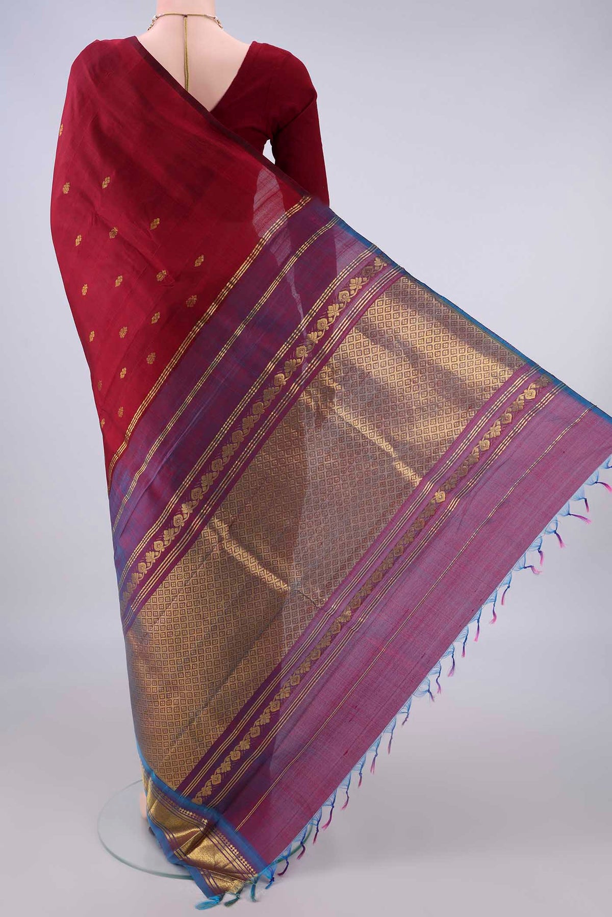 Flat view of Pure Silk Maroon Kanjivaram Saree with Zari Butta on the body and Zari Border. 