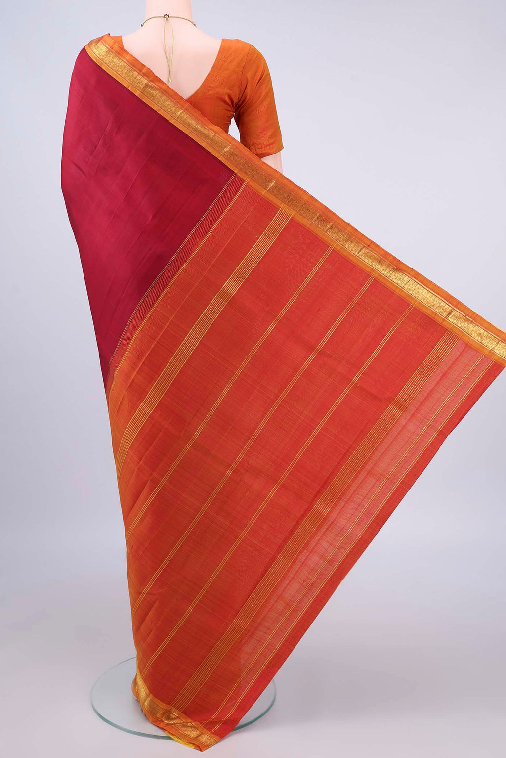 Flat view of Pure Silk Red Kanjivaram Saree with Plain Body and Zari Border. 