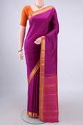 Pure Silk Magenta Kanjivaram Saree with Plain Body and Zari Border.  displayed on a mannequin