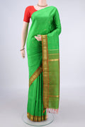 Pure Silk Green Kanchipuram Saree with Plain Body and One Side Border.  displayed on a mannequin