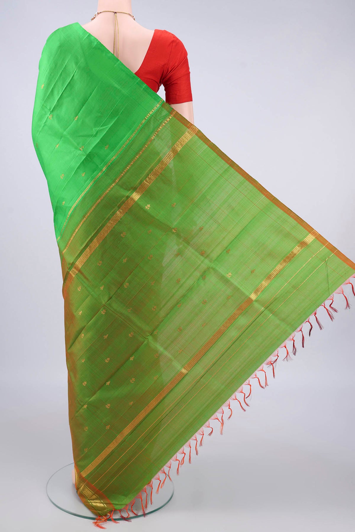 Flat view of Pure Silk Green Kanchipuram Saree with Plain Body and One Side Border. 