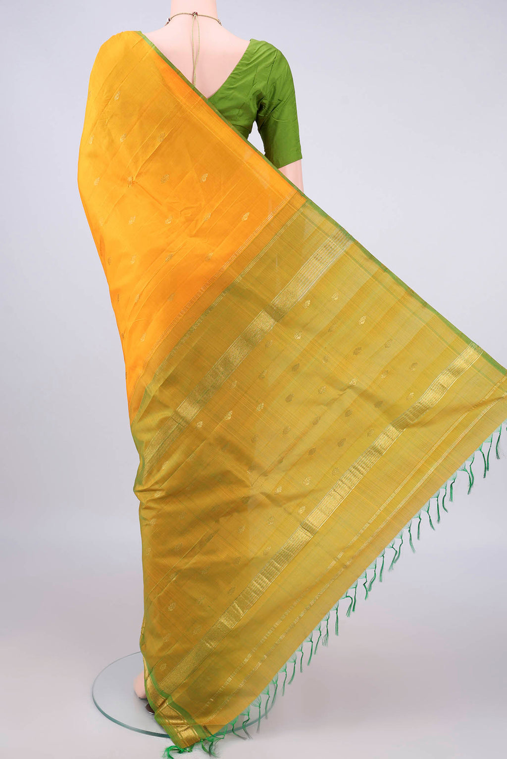 Flat view of Pure Silk Yellow Kanchipuram Saree with Zari Butta on the body and One Side Border. 