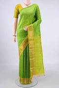 Pure Silk Parrot Green Kanjivaram Saree with Zari Butta on the body and One Side Border.  displayed on a mannequin