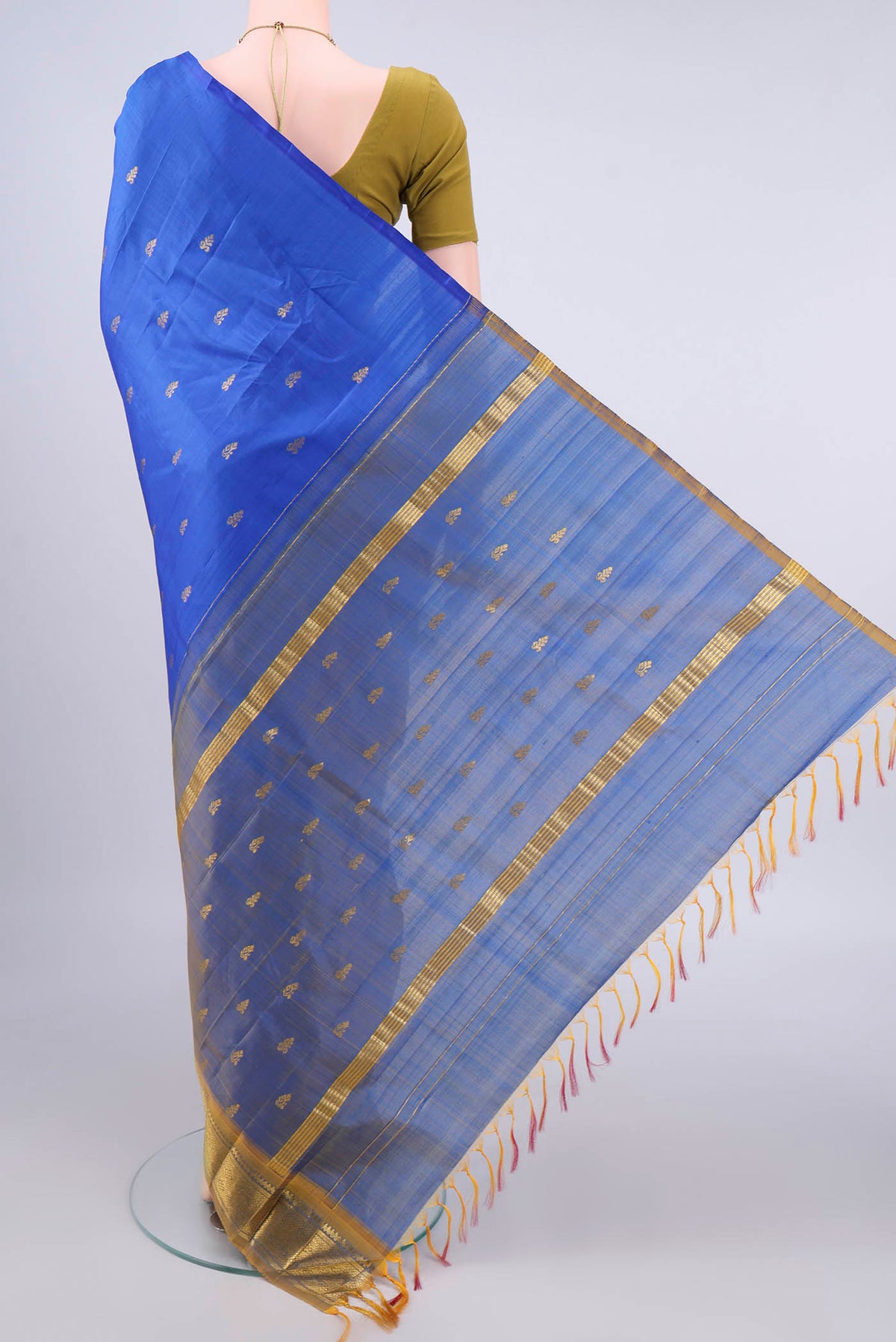 Flat view of Pure Silk Blue Kanjivaram Saree with Zari Butta on the body and One Side Border. 