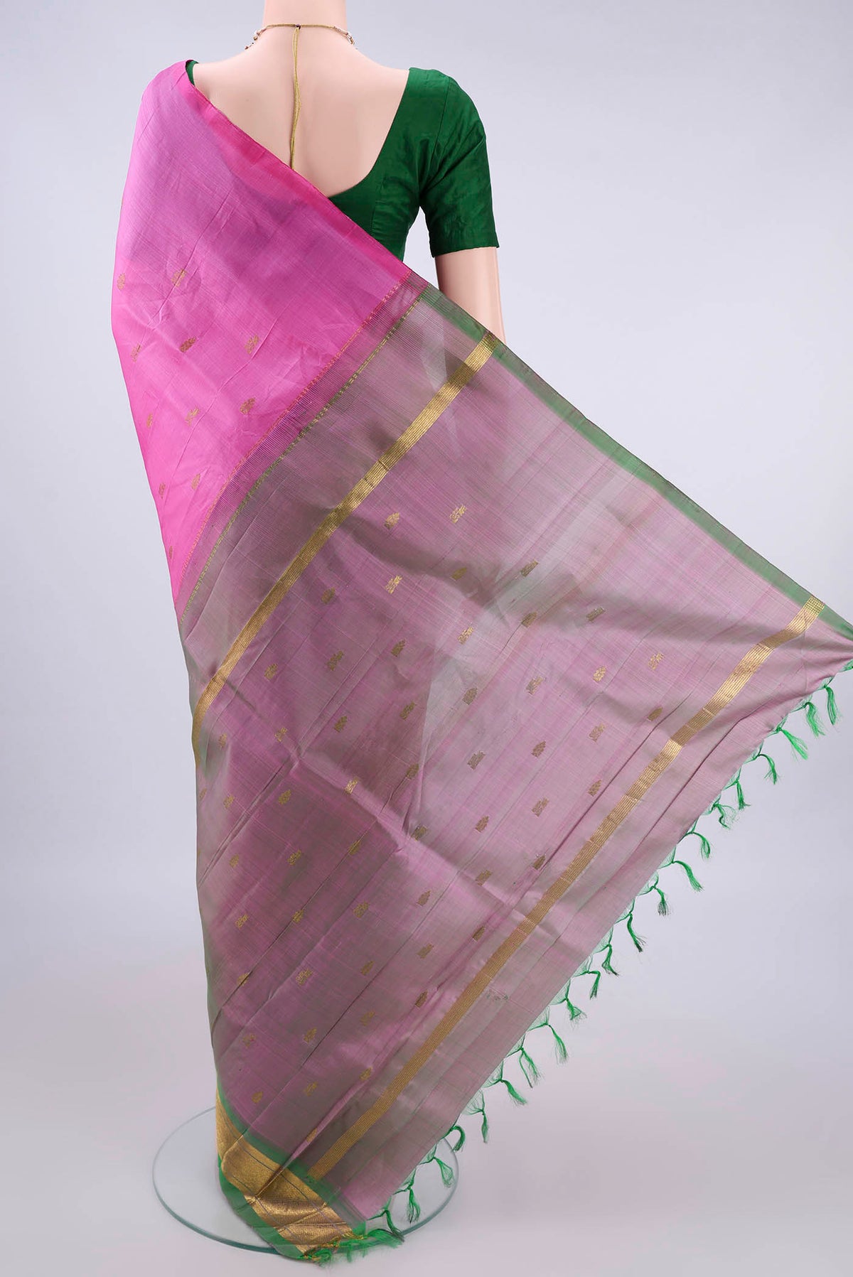 Flat view of Pure Silk Pink Kanjivaram Saree with Zari Butta on the body and One Side Border. 