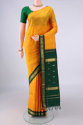 Pure Silk Yellow Kanjivaram Saree with Zari Butta on the body and Zari Border.  displayed on a mannequin