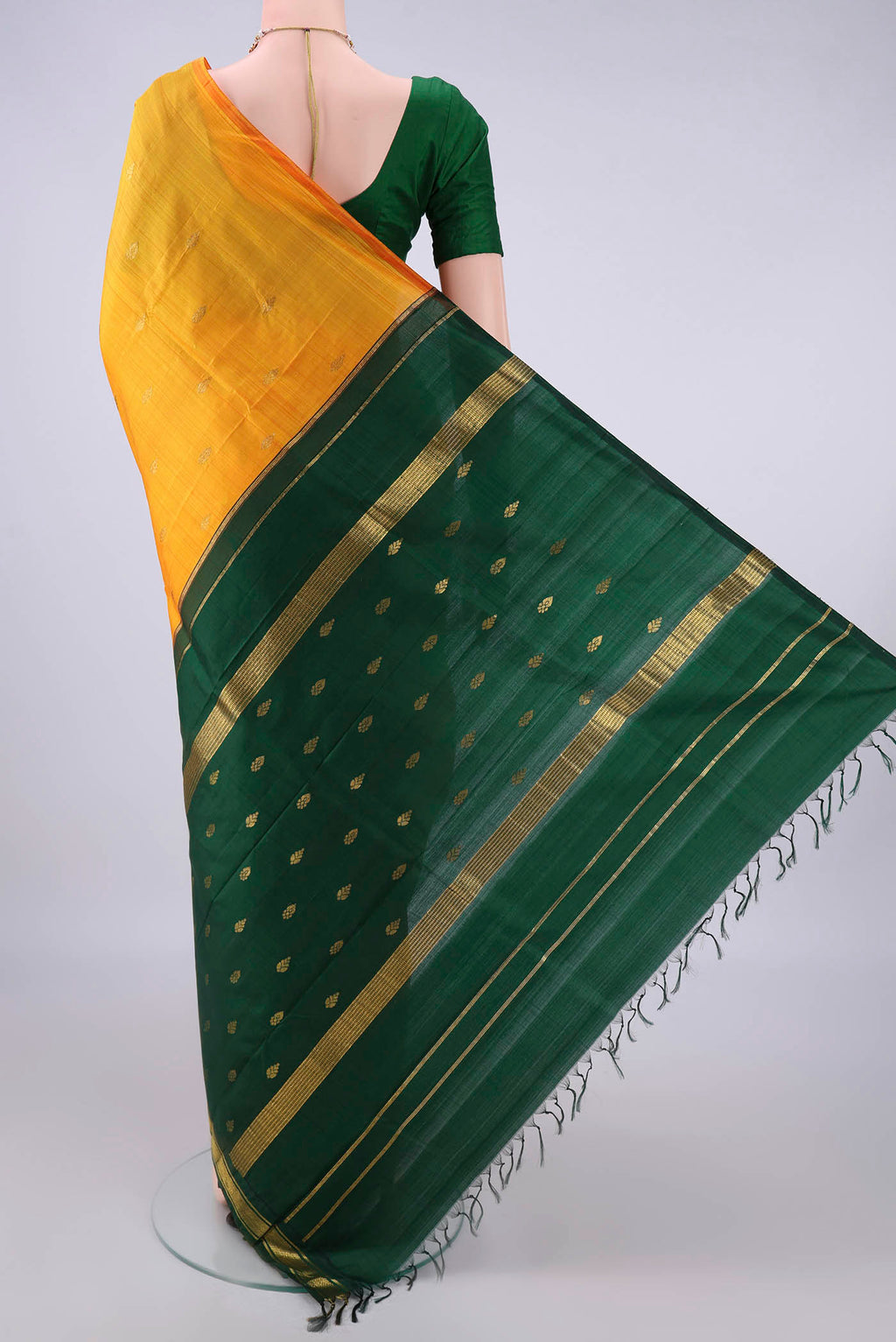 Flat view of Pure Silk Yellow Kanjivaram Saree with Zari Butta on the body and Zari Border. 
