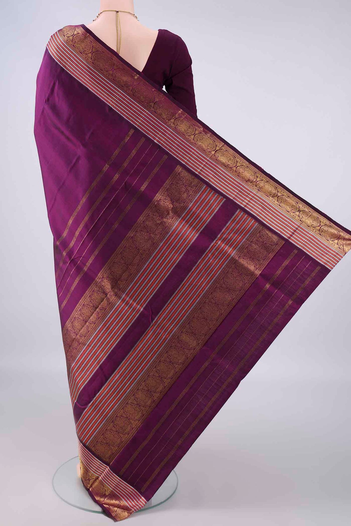 Flat view of Pure Silk Magenta Kanchipuram Saree with Plain Body and Zari Border. 