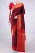 Pure Silk Maroon Kanjivaram Saree with Plain Body and Temple Border.  displayed on a mannequin