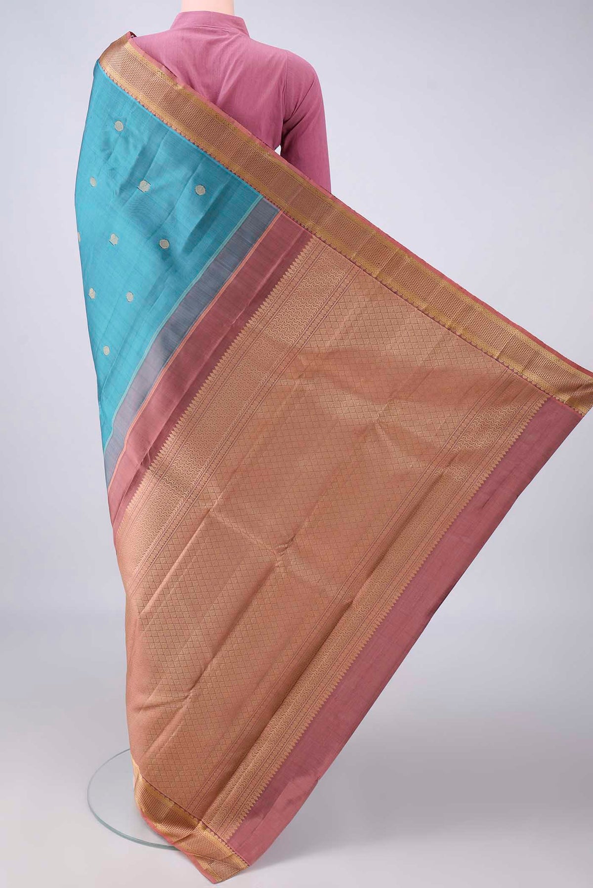 Flat view of Pure Silk Teal Kanjivaram Saree with Thread Butta on the body and Thread Border. 