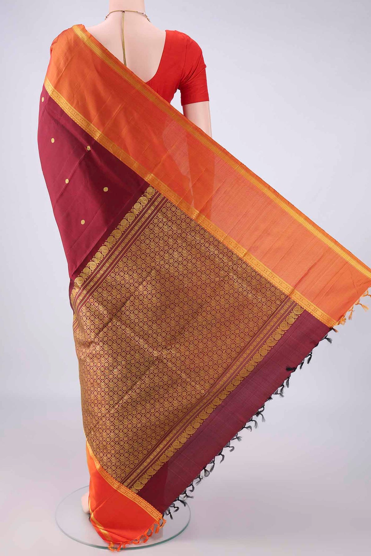 Flat view of Pure Silk Maroon Kanjivaram Saree with Thread Butta on the body and Thread Border. 