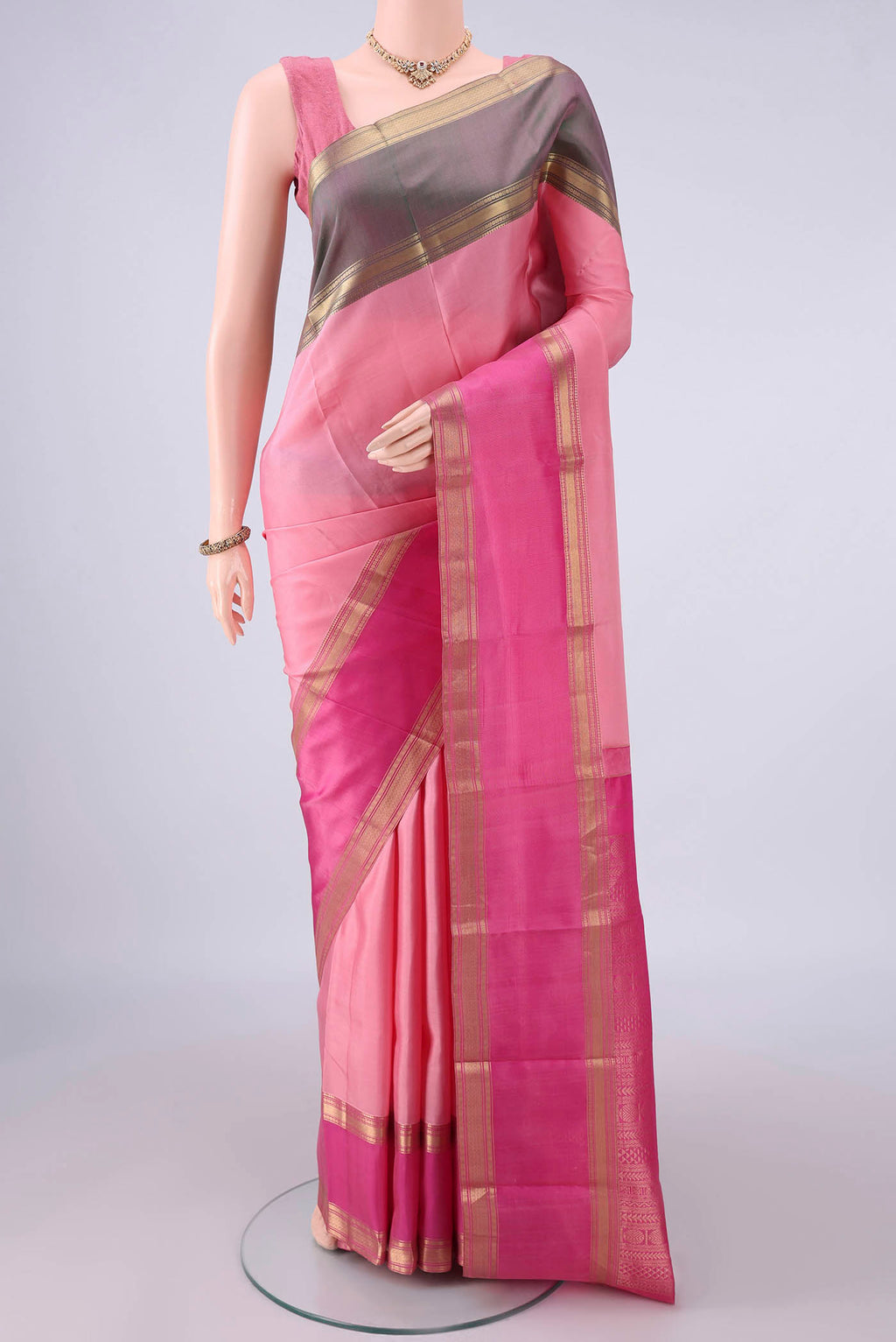 Pure Silk Rose pink Dual Tone Kanjivaram Saree with Plain Body and Ganga Jamuna Border.  displayed on a mannequin