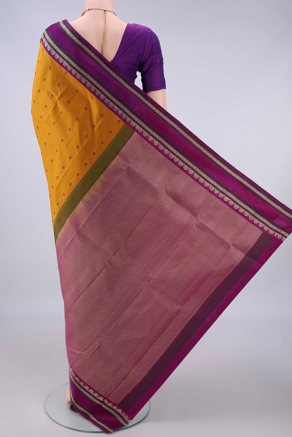 Flat view of Pure Silk Mustard Kanjivaram Saree with Thread Butta on the body and Thread Border. 