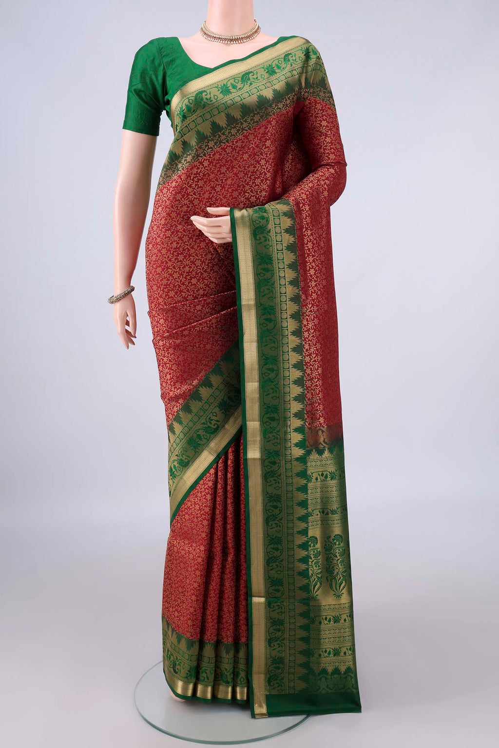 Pure Silk Maroon Soft Saree with Zari Brocade on the body and Zari Border.  displayed on a mannequin