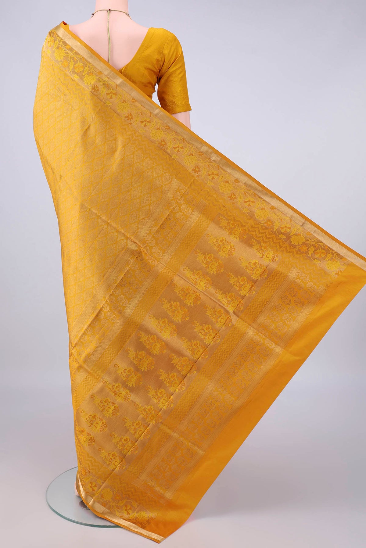 Flat view of Pure Silk Yellow Soft Saree with Zari Brocade on the body and Zari Border. 