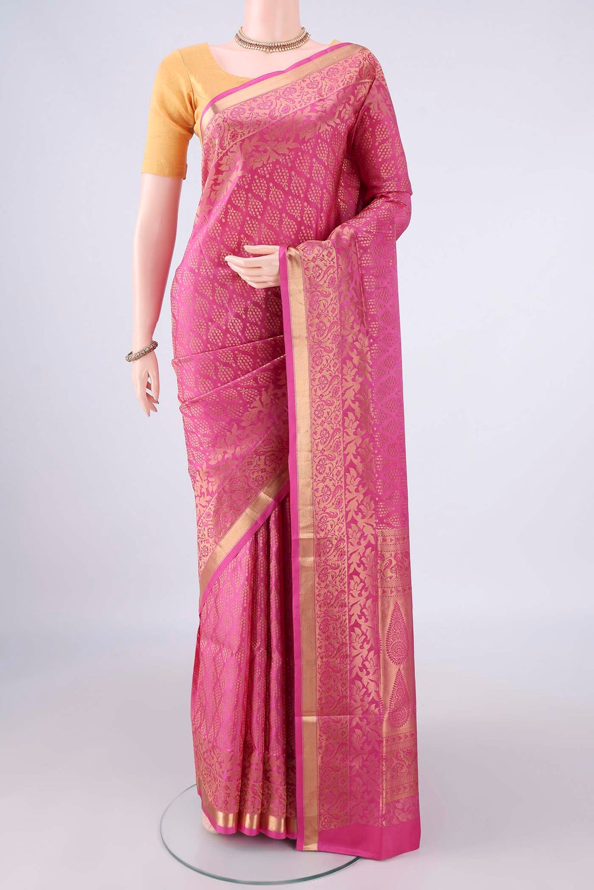 Pure Silk Rose pink Soft Saree with Zari Brocade on the body and Zari Border.  displayed on a mannequin