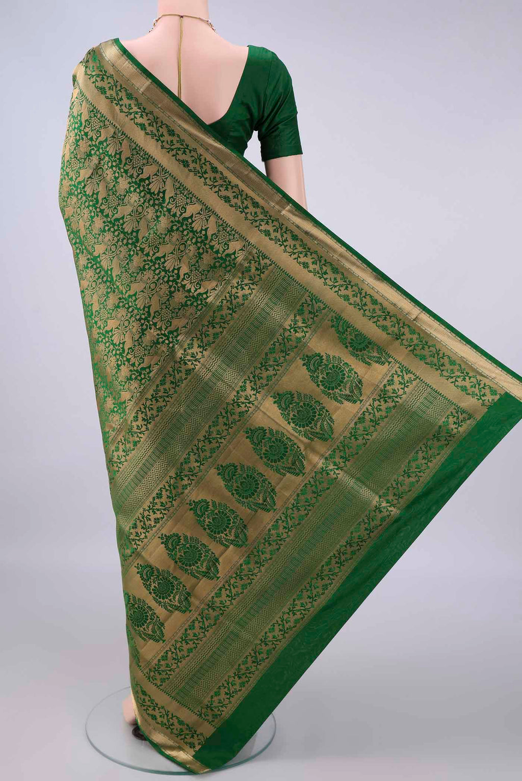 Flat view of Pure Silk Bottle Green Soft Saree with Zari Brocade on the body and Zari Border. 